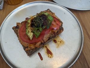 Open foccacia with cashew cheese at Oh My Goodness Specialty Breads in Hastings