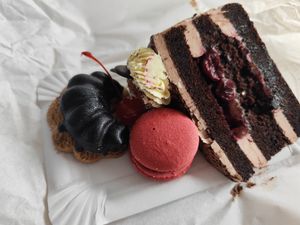 Peanut cookie, raspberry macaron, black forest cake (all vegan) at Brána ke Zdraví in Brno