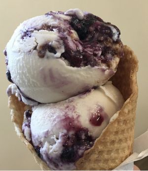 Two scoops of blueberry cheesecake ice cream  in a waffle cone🫐💕  at Crepe and Spoon in Minneapolis