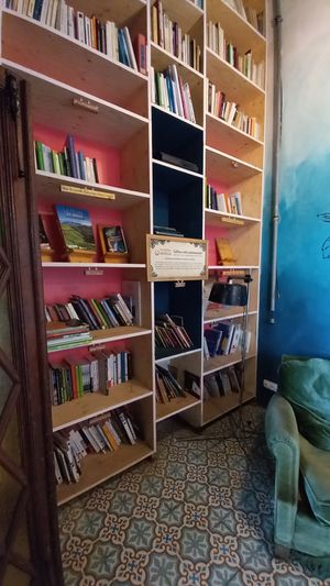library with books concerning sustainability at La Recyclerie in Paris