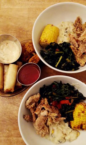 A real feast for the taste buds! Springrolls filled with sweet potatos, popcorn okra, creole mashed potatoes, fresh corn, cale and fried mushrooms. at Veggie Galore in Nijmegen