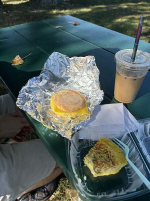 iced vanilla latte w/ oat milk (with coffee ice cubes so it doesn’t get watered down!!!) breakfast sandwich w/ vegan egg and chao cheese, and vegan frittata ☺️🩷  at Way Cup Cafe in Holland