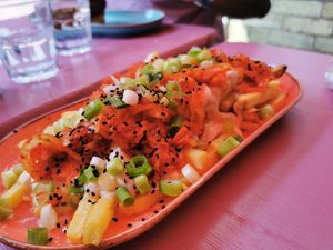Kimchi- Kraut Fries: limited Edition Ferment - Air-fried fries loaded with our kimchi-kraut, miso mayo, topped with spring onions, fresh lime juice, chilli flakes and sesame seeds. at DoppleGanger in Cambridge