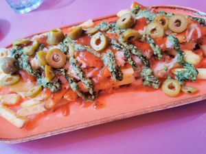 The Pizza Fries which are new: air fried fries topped with our homemade pizza sauce and melted mozzerella smothered in pesto and olives. 
 at DoppleGanger in Cambridge