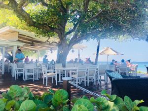 Outdoor seating  at Cotton House Beach Cafe in Mustique