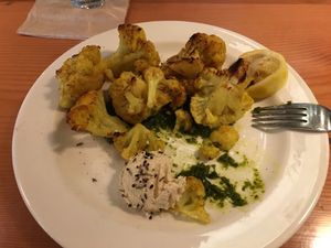 Roasted cauliflower appetizer with cashew cheese and pesto  at Hearth Artisan Pizza in Anchorage