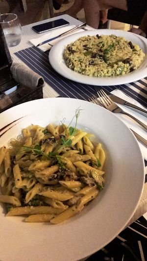Mushroom Penne with cashew cream and Saffron Risotto  at Two Buoys Bistro in St Julians
