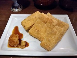Fried tofu skins with wasabi and radish garnish at Itoya in Matsumoto
