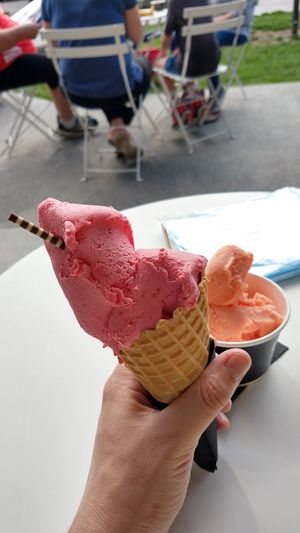 Raspberry sorbet with blood orange in the background at Black Peak Gelato in Wanaka