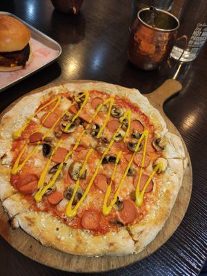 'wurst' pizza and burger with aubergine bacon at Happy Friday Kitchen  in Oxford