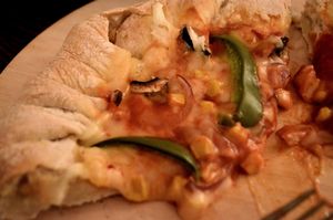 Notorious V.E.G stuffed crust pizza at Happy Friday Kitchen  in Oxford