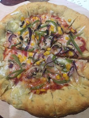 Vegan pizza with cheese-stuffed crust. Get the garlic mayo for crust-dipping purposes... at Happy Friday Kitchen  in Oxford