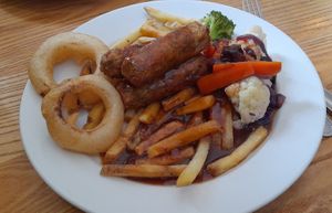 Trio of sausages with potatoes and vegetables at Green Dragon in Wymondham