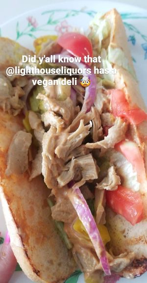 Chipotle Chick'n with red onion, pickles in a sub roll. at Bo Brooks' Lighthouse Liquors in Baltimore