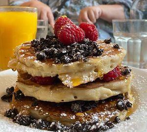 Vegan pancake stack with syrup, Oreos and raspberries (more of everything in between the layers)  at POG - Bachelor's Walk in Dublin