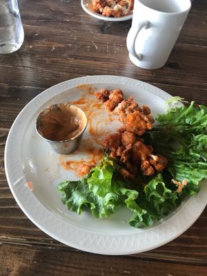 Half eaten vegan buffalo cauliflower  at The Acre - Wyoming Blvd in Albuquerque