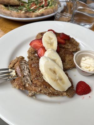 French toast and pizza in background   at Sage Regenerative Kitchen in Pasadena