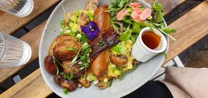 Breakfast pancakes with Beyond Meat sausage, vegan bacon, tofu eggs, potatoes, mushrooms and salad at Aujourd'hui Demain Cafe in Paris