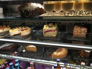 Too full to try a slice of cake. We need to come back  at Aujourd'hui Demain Cafe in Paris