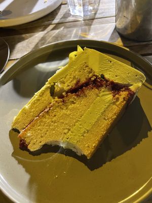 Matcha cake with a bite taken out of it lol  at Aujourd'hui Demain Cafe in Paris
