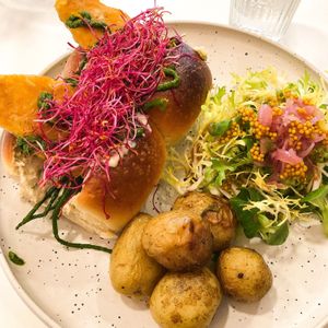 Burger brioché aux filets de "poisson"  at Aujourd'hui Demain Cafe in Paris