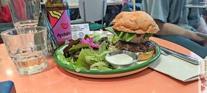 Christmas Burger : Homemade artisan bun, reworked beyon meat steak, homemade brandy foigra, homemade truffle mayo, fig cranberry, pink berry and beet sprout chutney, served with ro at Aujourd'hui Demain Cafe in Paris
