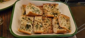 Garlic bread. Taste is very light, too light. It's just bread... at Aujourd'hui Demain Cafe in Paris