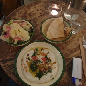 Side salad and vegan syrian cheese with pita bread at Aujourd'hui Demain Cafe in Paris