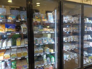 Four fridges of vegan cheeses!! at Aujourd'hui Demain Cafe in Paris