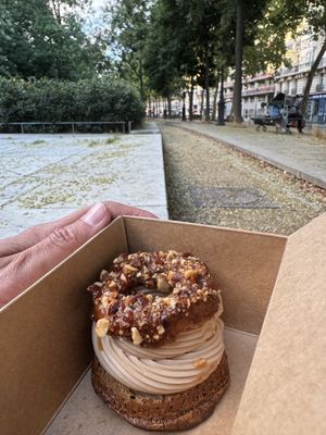 A Paris-Brest dessert that I took out and devoured nearby  at Aujourd'hui Demain Cafe in Paris