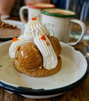 Pine nut/rosemary Saint-Honoré + Capuccino at Aujourd'hui Demain Cafe in Paris