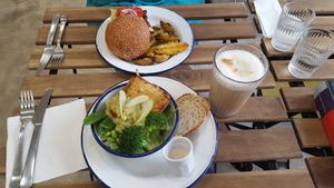 Burger and green bowl at Aujourd'hui Demain Cafe in Paris