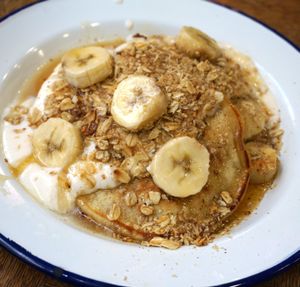Pancakes w/granola and yoghurt at Aujourd'hui Demain Cafe in Paris