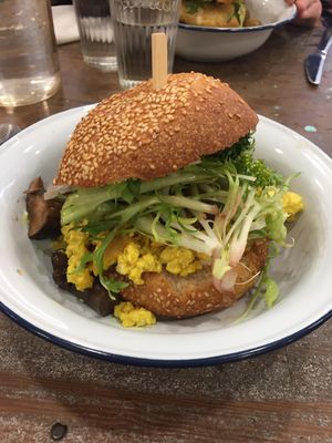 Breakfast burger avec verdure, tofu brouille, champignons et oignons cuits  at Aujourd'hui Demain Cafe in Paris