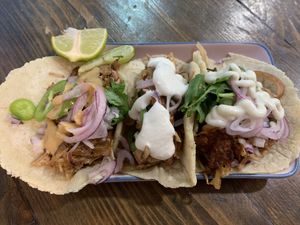 Trio of jackfruit carnitas with peanut sauce, lemon yogurt, and mayo (all vegan)! at Aujourd'hui Demain Cafe in Paris