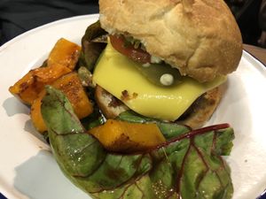 Burger with lettuce and pumpkin  at Aujourd'hui Demain Cafe in Paris