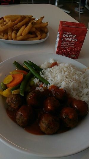 veggie balls plate with delicious lingonberry juice and fries at IKEA in Dartmouth