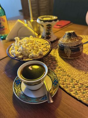 Coffee, served with popcorn   at Gezana Eritrean Restaurant in Eindhoven