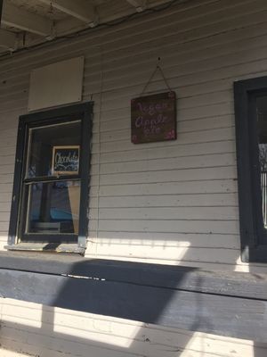 Sign advertising vegan pie. She just opened recently so phone number was not working yet as of 12/31/17 at Juliantla Chocolate in Julian