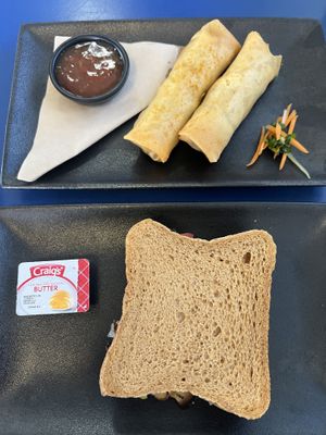 Spring rolls and toastie sandwich served with regular butterr  at The Olive Tree Cafe in Te Anau
