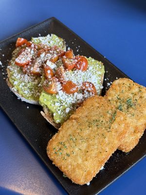 Avocado & Feta Toast (requested vegan) + hash brownss  at The Olive Tree Cafe in Te Anau