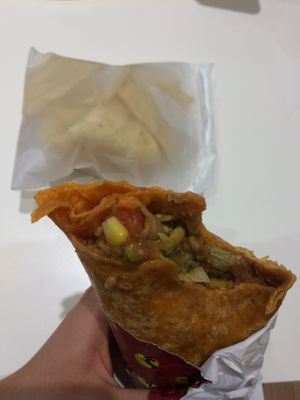 Delicious bean burrito with rice, veggies, guacamole and tortilla chips on the side! at Burrito Loco - Spalena in Prague