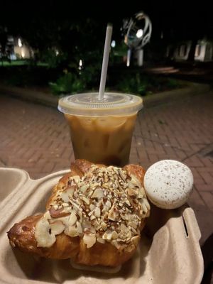 Iced vanilla & cinnamon latte with a macaroon & almond croissant  at Fox & Fig in Savannah