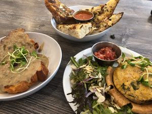 (Left) Croissant & Gravy. (Far Middle) Garlic Bread. (Right) Quiche.  at Fox & Fig in Savannah