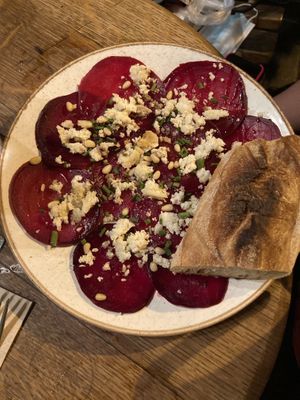 Beetroot carpaccio with vegan feta cheese  at Chateau Shual in Tel Aviv