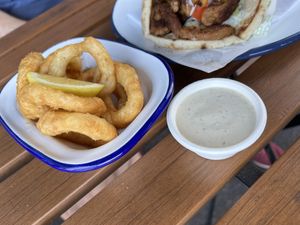Onion rings with tahini side  at What The Pitta in North West London