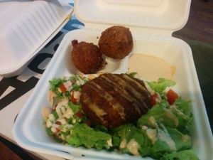 Dadgumit - Delicious vegan krab cake salad with aioli, and a side of moist and crunchy hush puppies at Murray Hillbilly in Jacksonville