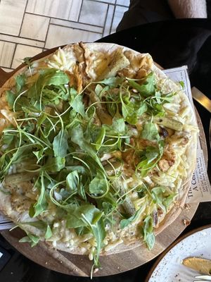 Incredible mushroom truffle béchamel pizza  at Wild Food in Granada