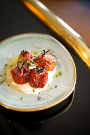 Semidry tomatoes with burrata cheese at Wild Food in Granada