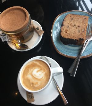 Peppermint tea, soy milk coffee, gluten free / vegan banana bread. at Wild Food in Granada